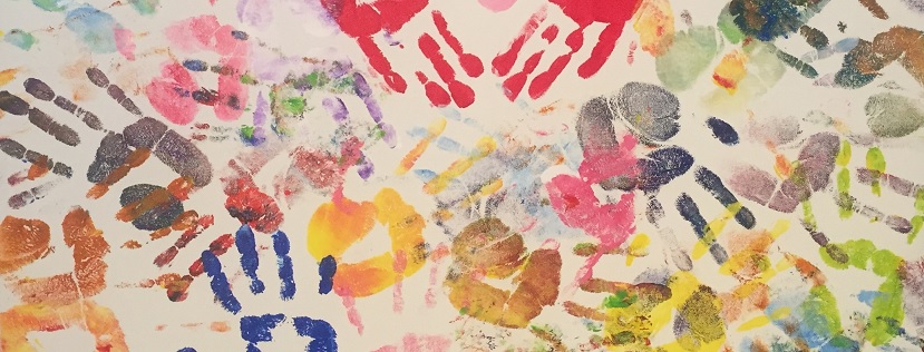 A painting made up of multiple handprints