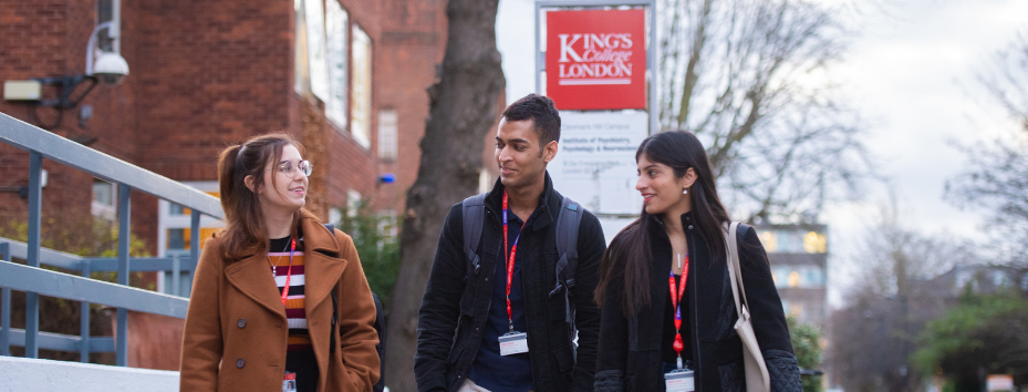 Three stuedents walking outside the King's IoPPN building talking to each other